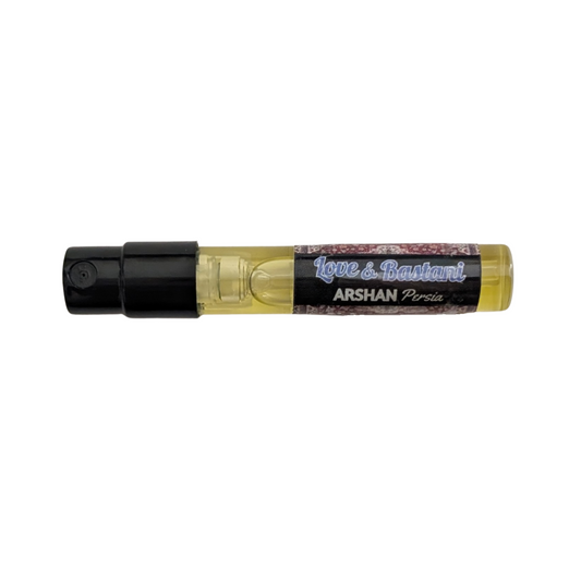 A 2ml perfume sample bottle with a decorative, patterned label.
